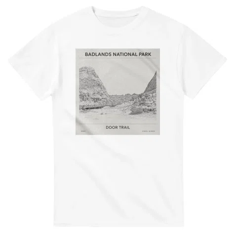 Fine-line engraving-style drawing for Badlands National Park, with a landmark caption and small coordinate text.