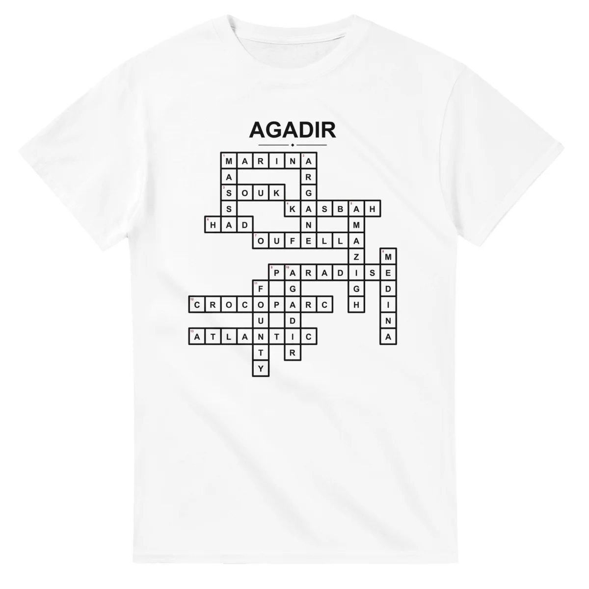 Monochrome crossword sheet for Agadir, with a large place-name heading, a letter grid, and numbered across and down clues.