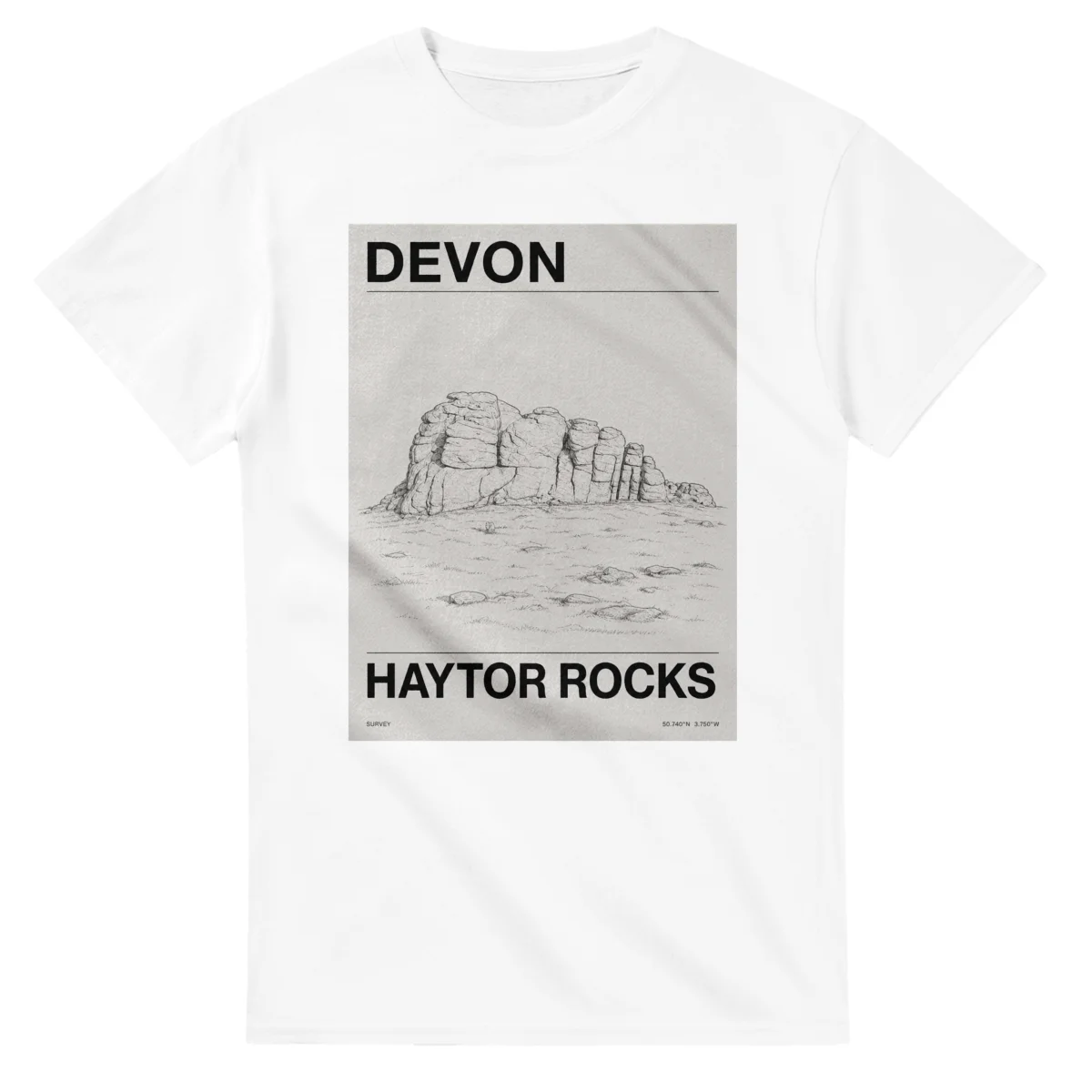 Fine-line engraving-style drawing for Devon, with a landmark caption and small coordinate text.